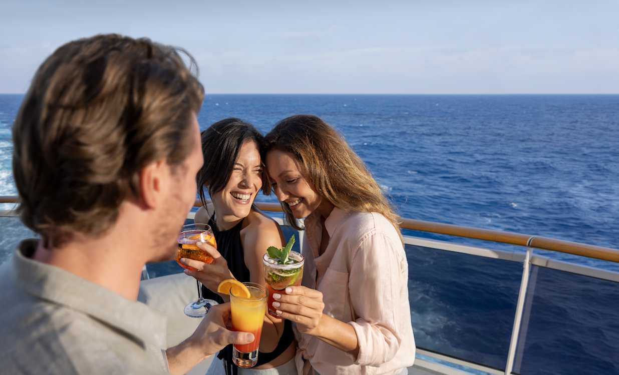 People with drinks on a MSC Cruises ship